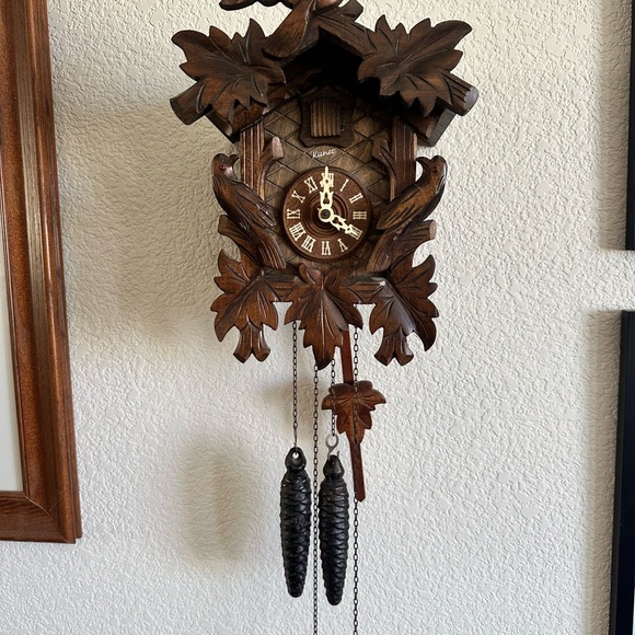 Rustic Brown Wall Clock with Intricate Carvings